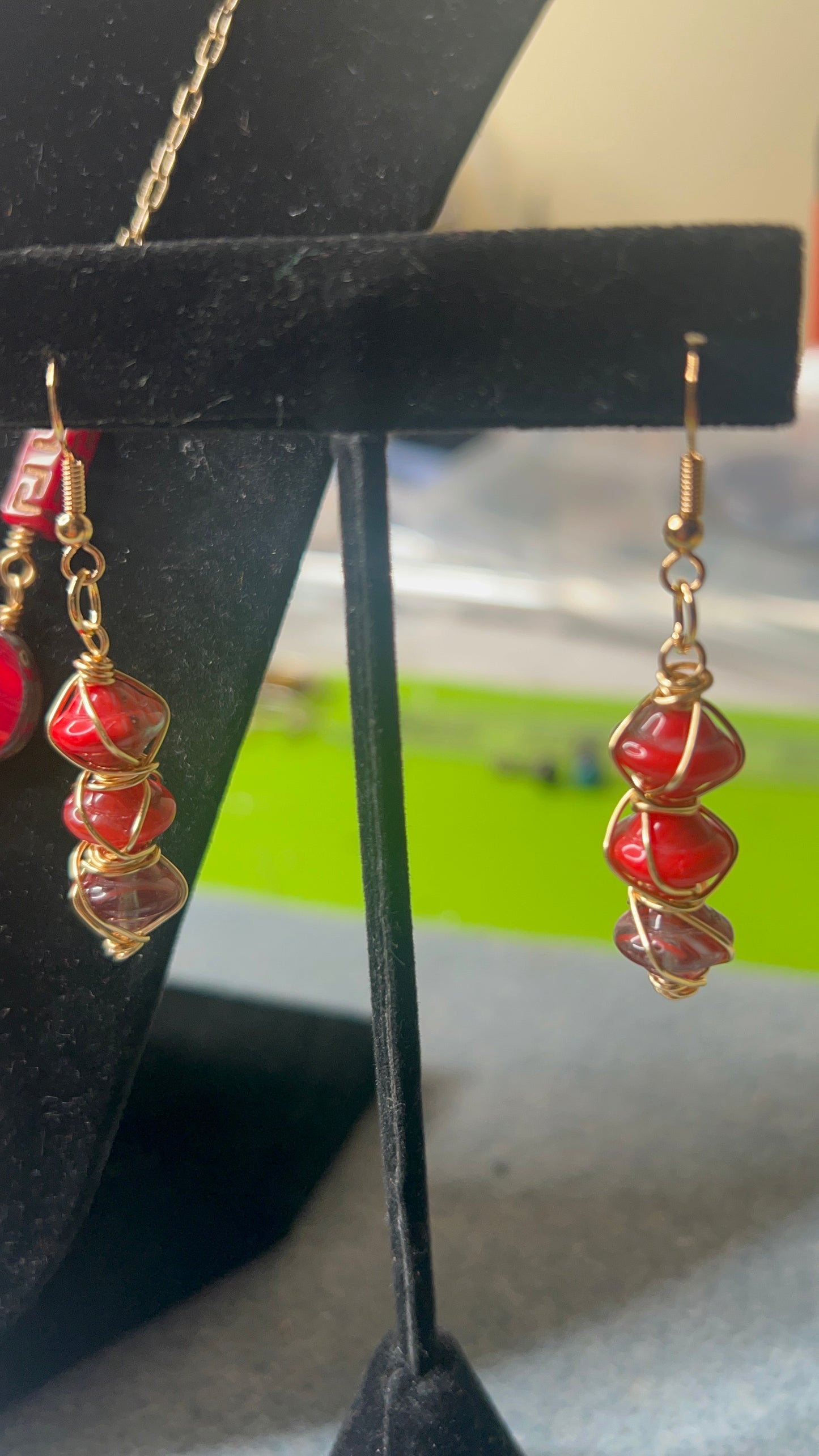 Silky Red with gold and bronze hues Beads with gold chain and matching earrings