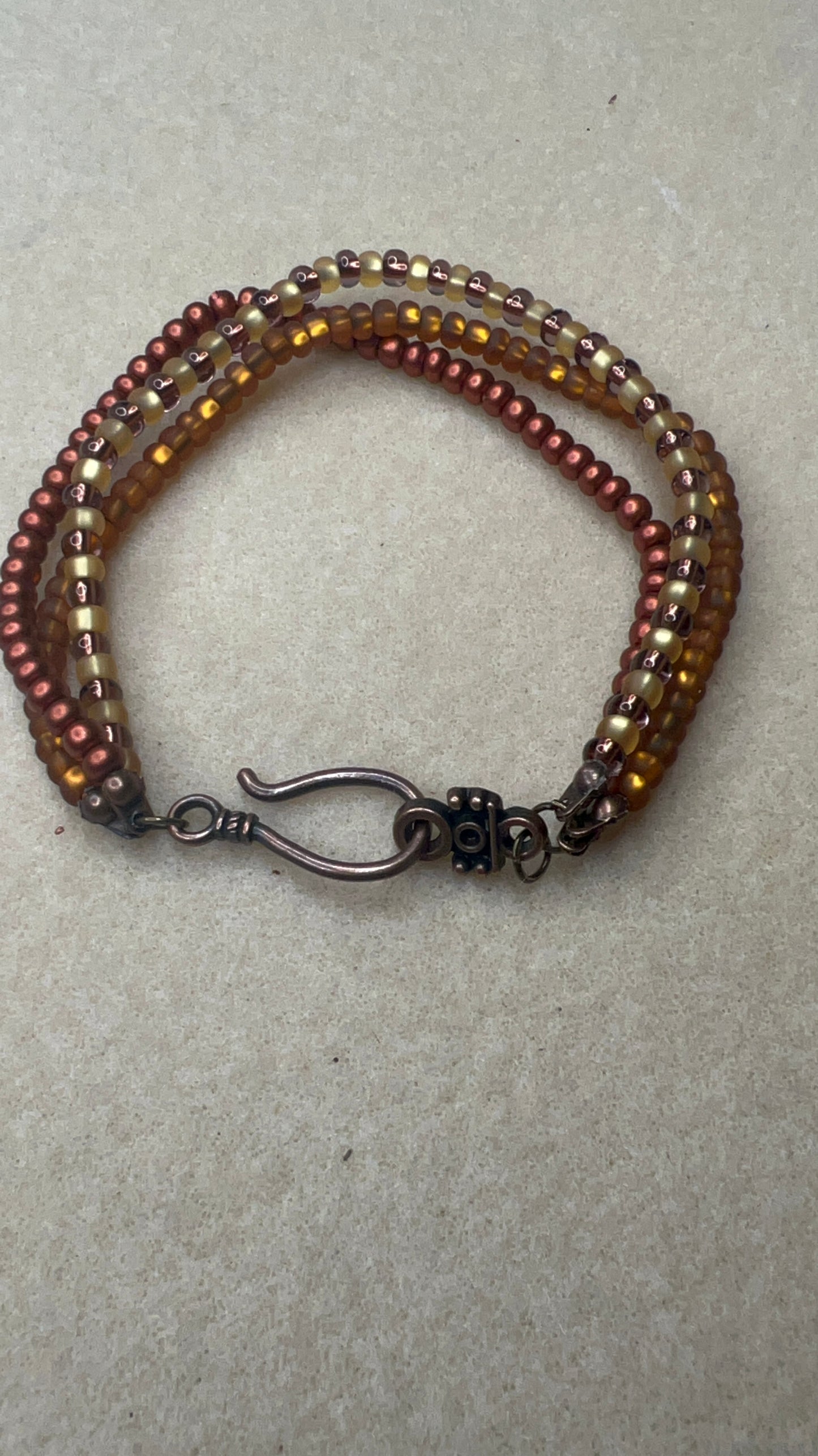 Triple Strand Bracelet with Hook Closure - Matte Gold, Matte Bronze, Yellow and Bronze Beads