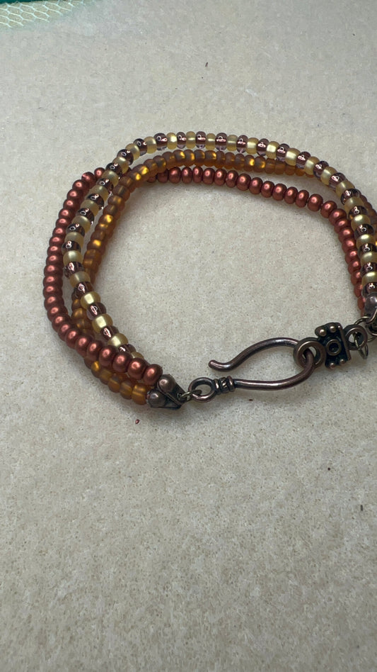 Triple Strand Bracelet with Hook Closure - Matte Gold, Matte Bronze, Yellow and Bronze Beads