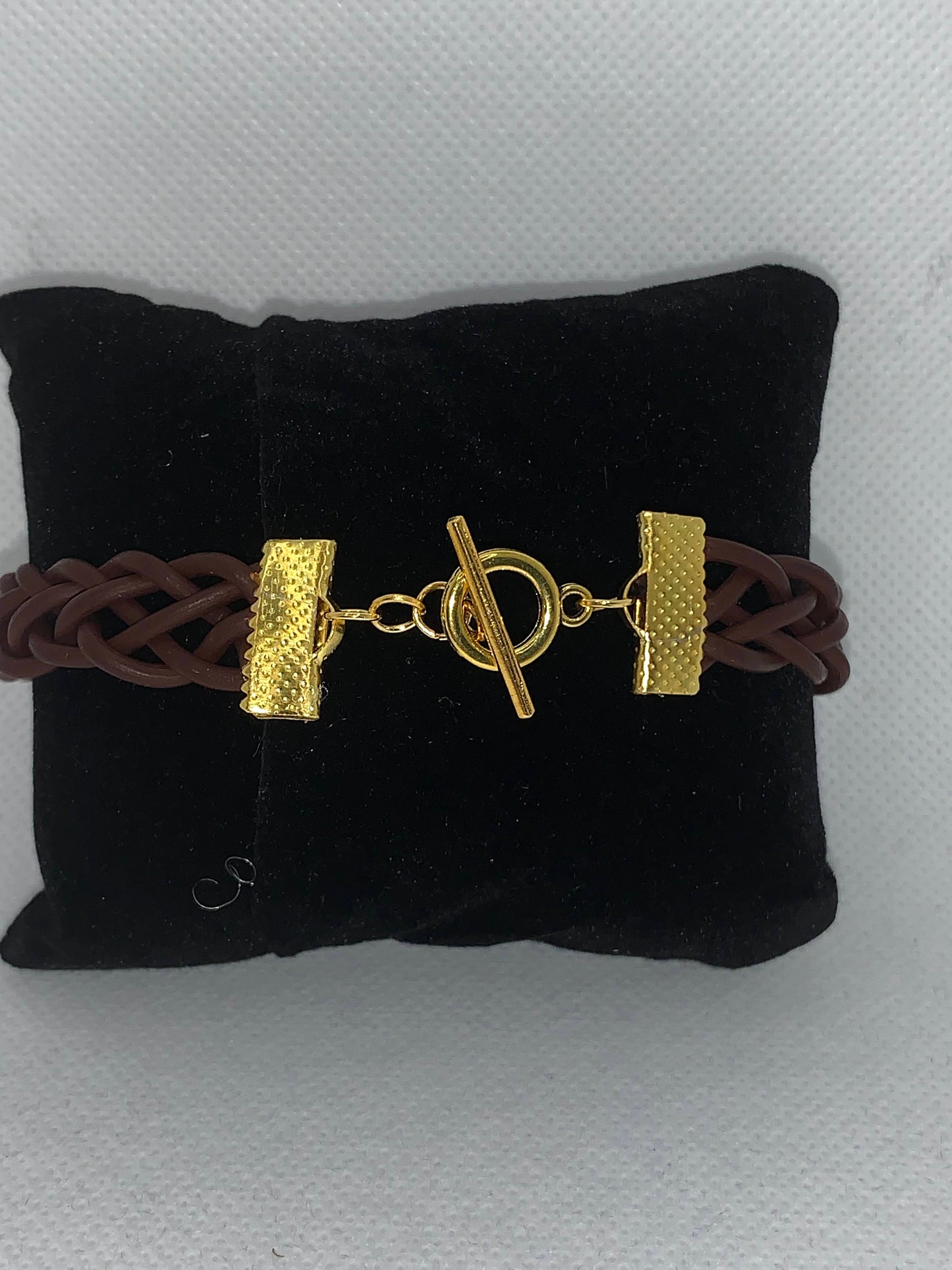 Brown braided and gold leather bracelet