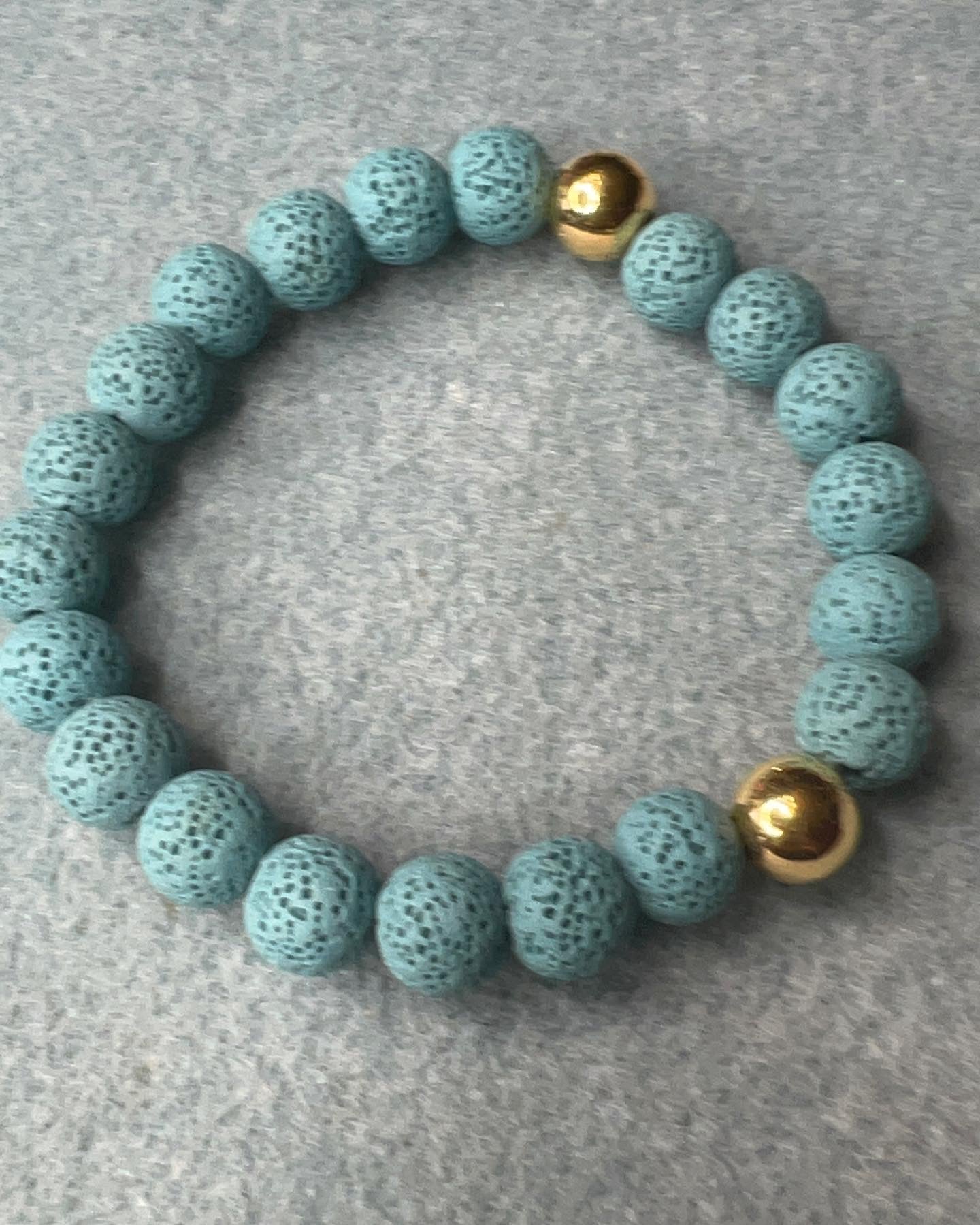 Carolina Blue 10mm Lava Beads with Gold Beads stretch bracelet